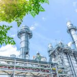 Iowa Steel Shock: $15B On The Line Industrial power plant with tall chimneys under blue sky