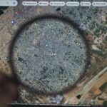 U.S.-Backed Board Drops $2.45B Bombshell Magnifying glass highlighting Gaza on a digital map