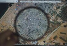 U.S.-Backed Board Drops $2.45B Bombshell Magnifying glass highlighting Gaza on a digital map