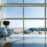 Air-Traffic Meltdown Freezes Northeast Hubs Airport terminal with plane at gate viewed through large windows