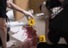 Fentanyl Whispers Cloud Hayden’s Final Call forensic investigators documenting a bloodstained crime scene