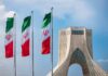 Hormuz Drama: Iran Maps A New Lane Iranian flags beside Azadi Tower in Tehran