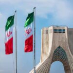 Hormuz Drama: Iran Maps A New Lane Iranian flags beside Azadi Tower in Tehran