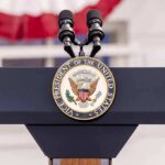 Working-Class Brawl Erupts In Michigan podium with microphones and U.S. vice presidential seal