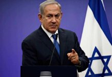 Election Shock: Trump Backs Netanyahu man in suit speaking at a podium with an Israeli flag