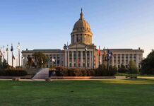 Capitol Clash: False-Testimony Charge Erupts Capitol building with dome and surrounding flags