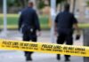 Brutal Case Ignites Japan – US Showdown Police officers walking past caution tape at a crime scene