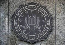 FBI Probes Mysterious Election Mailings FBI seal mounted on a granite wall