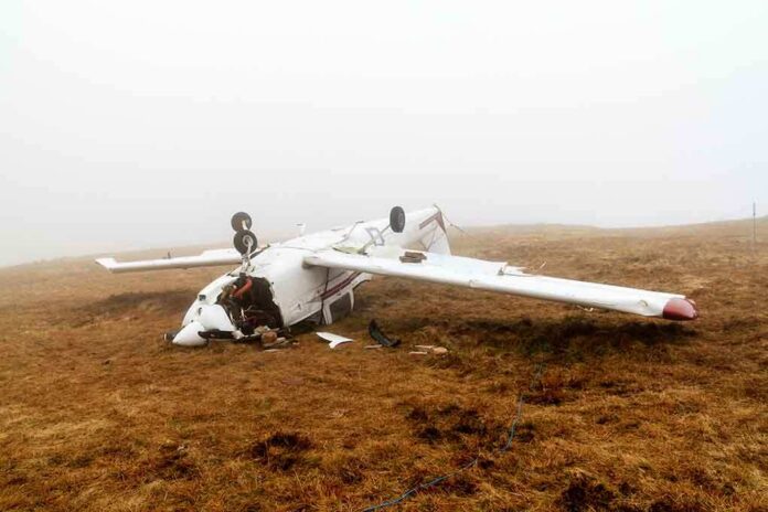 shutterstock_128891288 Crashed airplane lying on its side in a foggy field