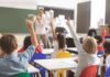 Florida Classroom Clash Sparks Felony Firestorm Elementary students raise hands in a classroom