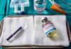 Pentobarbital Misfire – State Freezes Death Row Medical tray with syringe and pentobarbital vials on gauze
