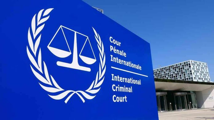 shutterstock_1383842291 International Criminal Court sign with scales emblem outside modern building