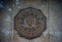 Grim Allegation Sparks Cross-Border Scrutiny FBI seal on a granite wall
