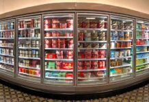 Grocery store freezer aisle with ice cream and frozen desserts