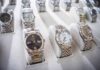 Luxury wristwatches displayed in a store case