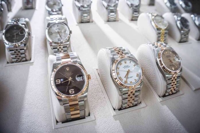 shutterstock_1634151832 Luxury wristwatches displayed in a store case