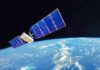 Stealthy Space Maneuver Targets Ukraine Ally Satellite with blue solar panels orbiting Earth