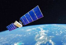 Satellite with blue solar panels orbiting Earth