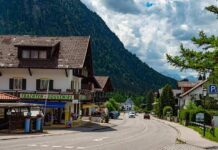 Alpine Inferno Stuns Germany mountain village street with alpine houses and shops