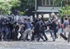 Troops Deployed After Milan Chaos Protesters clash with riot police holding shields