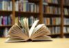 Open book on a table in a library