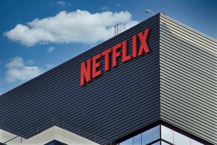 shutterstock_2062987472-1 Netflix logo on modern office building exterior