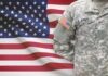 Fort Hood Survivor Seeks Justice Without Spectacle U.S. Army soldier in camouflage uniform before American flag