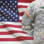 Fort Hood Survivor Seeks Justice Without Spectacle U.S. Army soldier in camouflage uniform before American flag