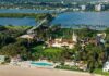 Trump’s Golf Deal Sparks County Showdown Aerial view of a waterfront estate with pool, lawns, and palm trees
