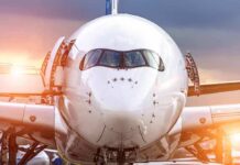 Front view of a commercial airplane on the tarmac