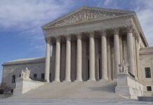 High Court Halts Prison Care Crackdown Supreme Court building with grand columns and steps